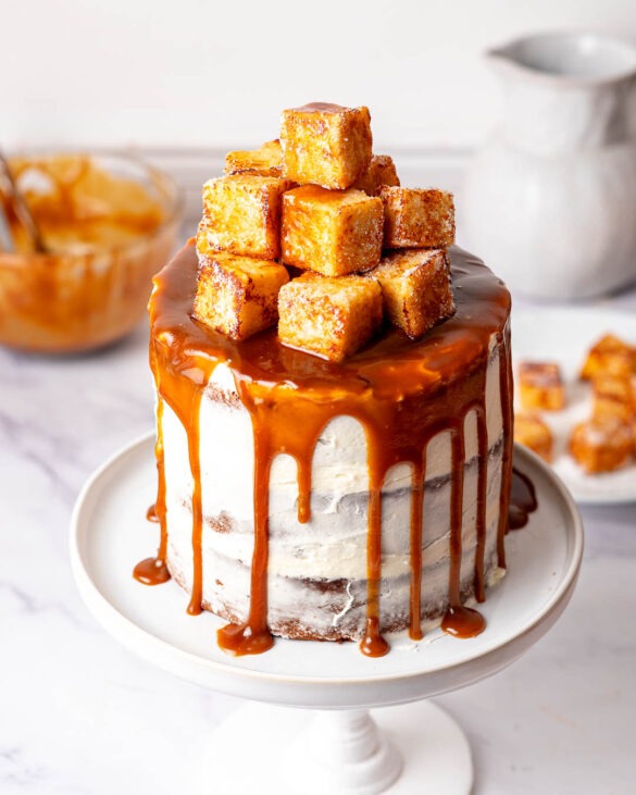 Sticky toffee pudding cake on a cake stand.