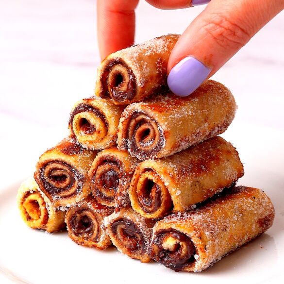 Stack of mini Nutella French toast roll ups.
