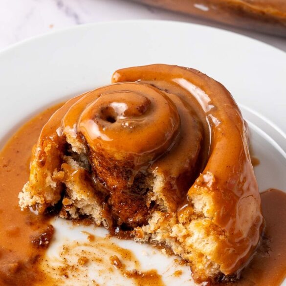 Caramel pumpkin spice latte roll on a plate.