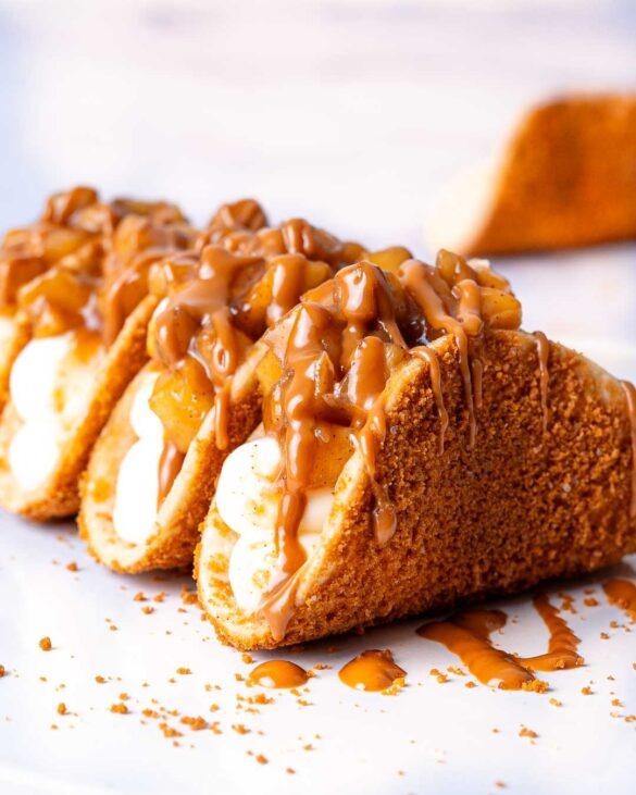 Apple pie cheesecake tacos on a plate.