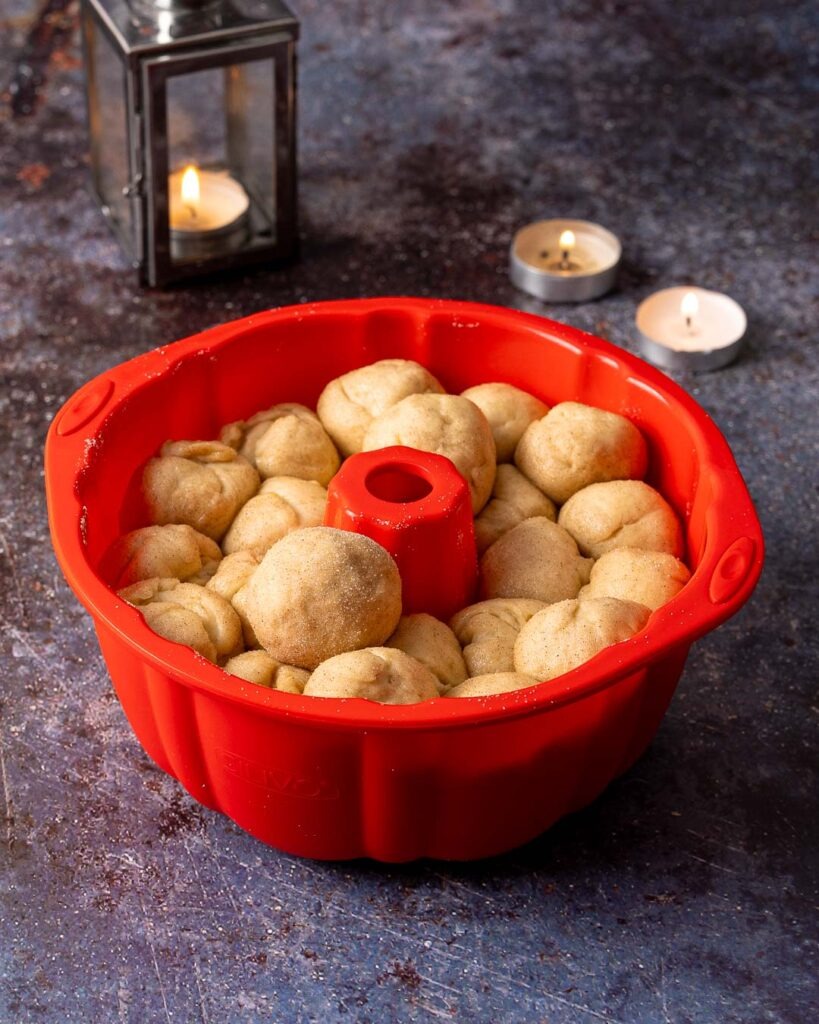 Monkeys bread dough balls in a Bundt mould before being baked in the oven.