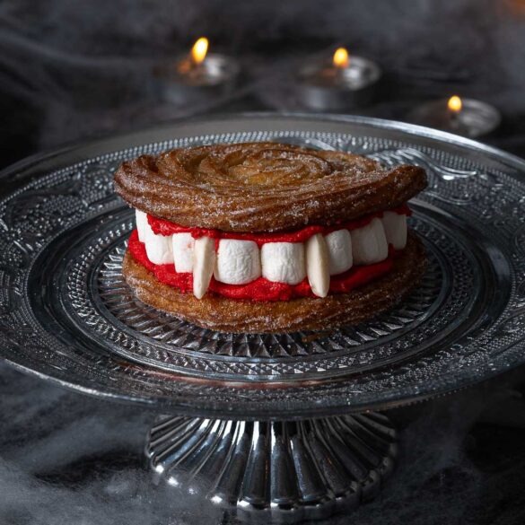 Vampire teeth churros on a silver cake stand