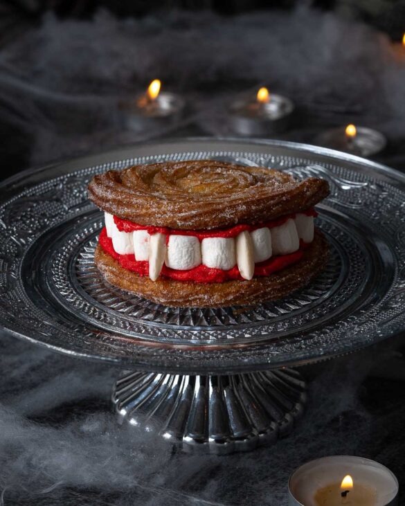 Vampire teeth churros on a silver cake stand