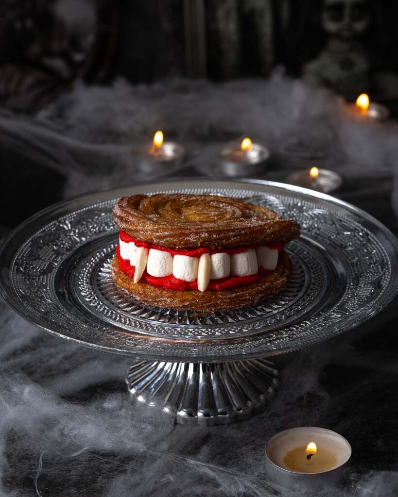 Vampire teeth churros on a silver cake stand