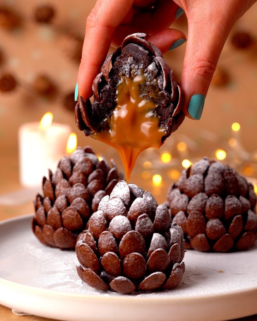 Inside of a brownie pine cone with caramel dripping out.