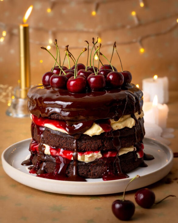 Black Forest chocolate fudge cake with cherries on top.