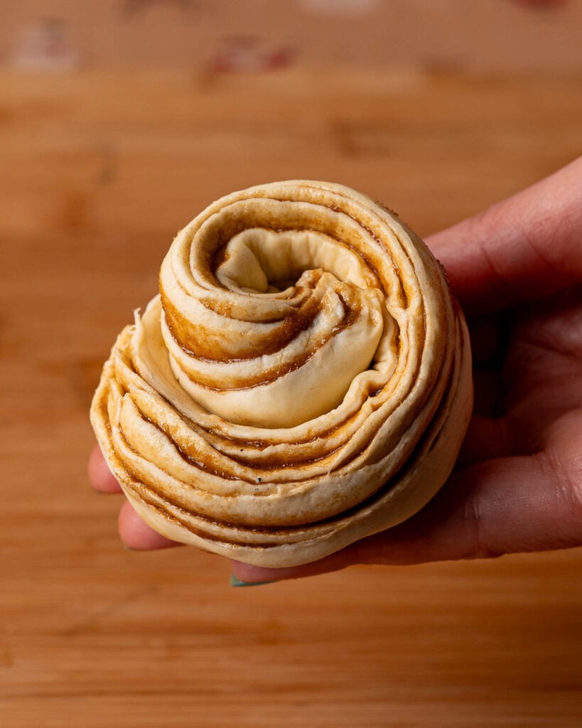 Cruffin rolled up before being baked in the oven.