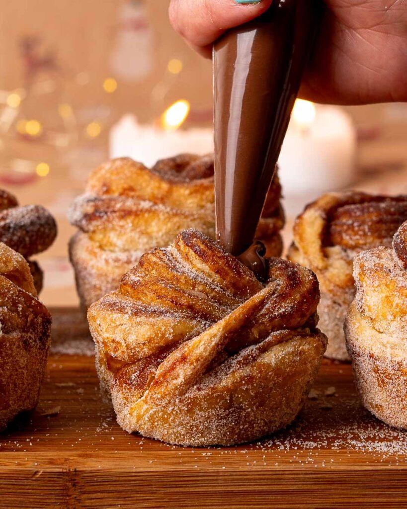 Cruffin being filled with Nutella in the middle.