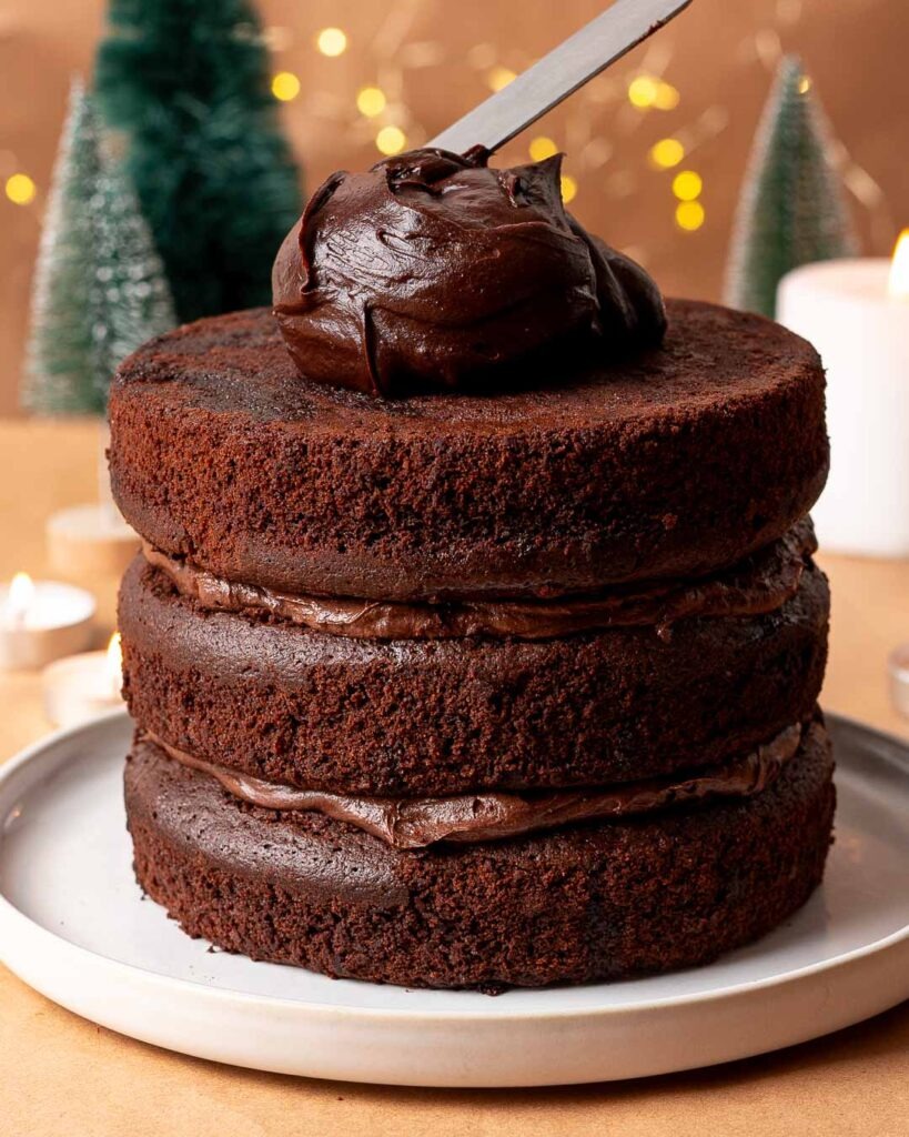 Chocolate ganache on top of a chocolate fudge cake.