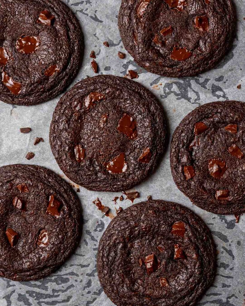 Chocolate cookies on a baking tray.