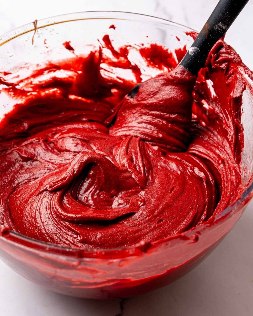 Red velvet brownie batter in a mixing bowl
