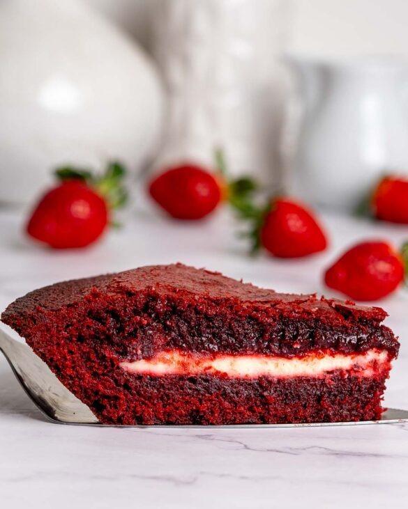 Slice of red velvet cheesecake brownie pie.