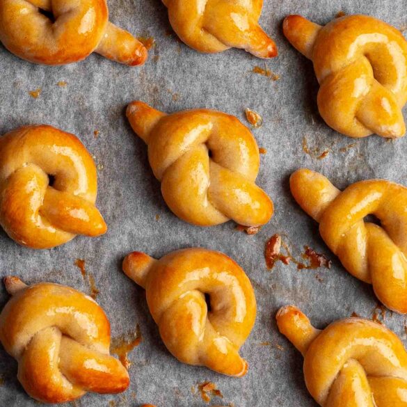 Pretzel knots on a baking tray.