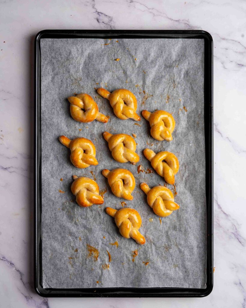 Pretzel knots on a baking tray