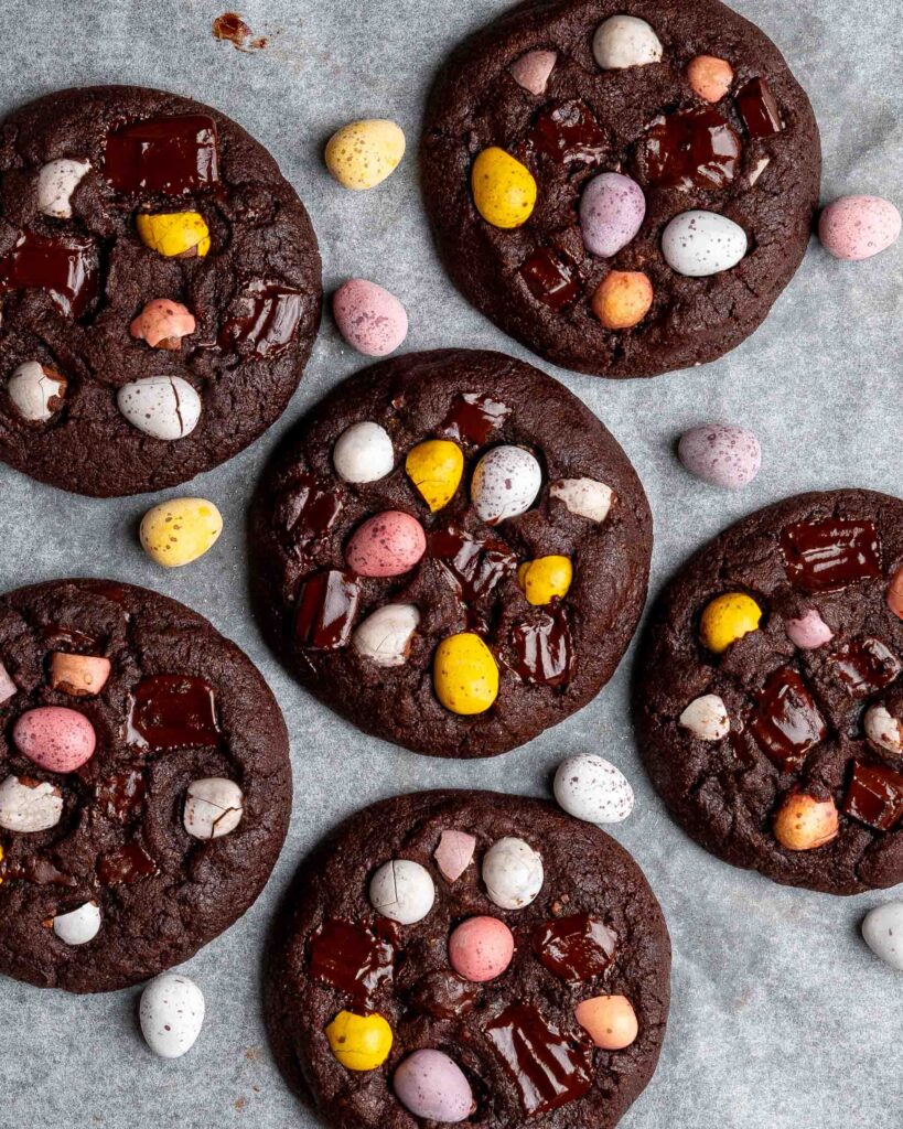 Mini egg cookies on a baking tray.