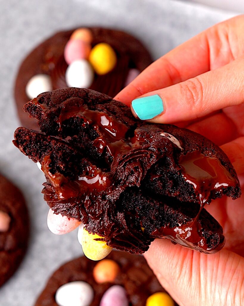 Mini egg cookie broken in half to reveal the inside.