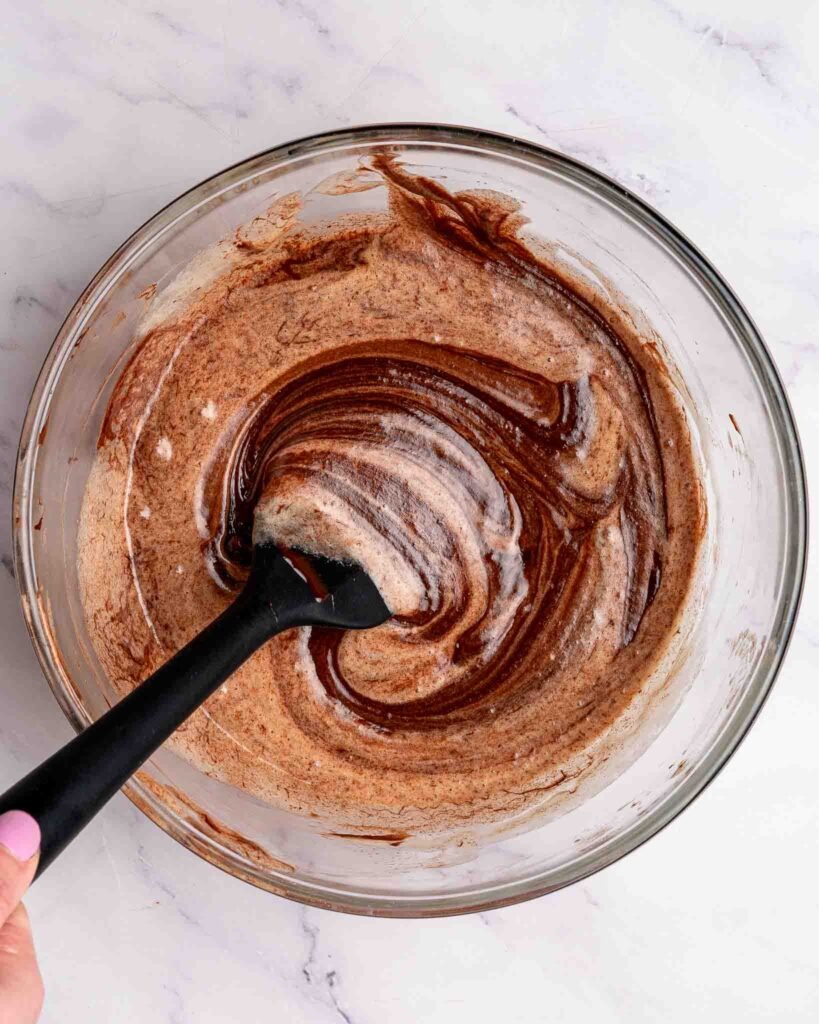Flourless brownie batter being mixed in a bowl