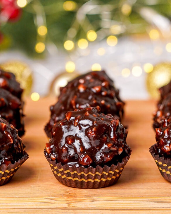 Close-up of Ferrero Rocher Nutella cake truffles served in real Ferrero Rocher cups, featuring a rich chocolate coating and hazelnut topping.