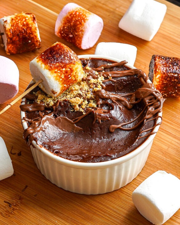 S’mores Chocolate Mousse in a ramekin with a toasted marshmallow on top.