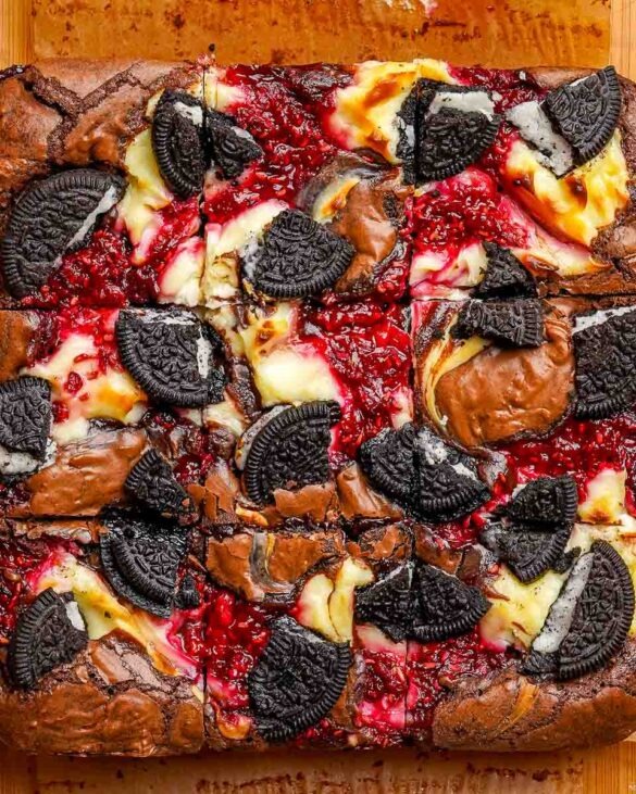 Top down image of Oreo raspberry cheesecake brownies that have been cut into 9 squares.
