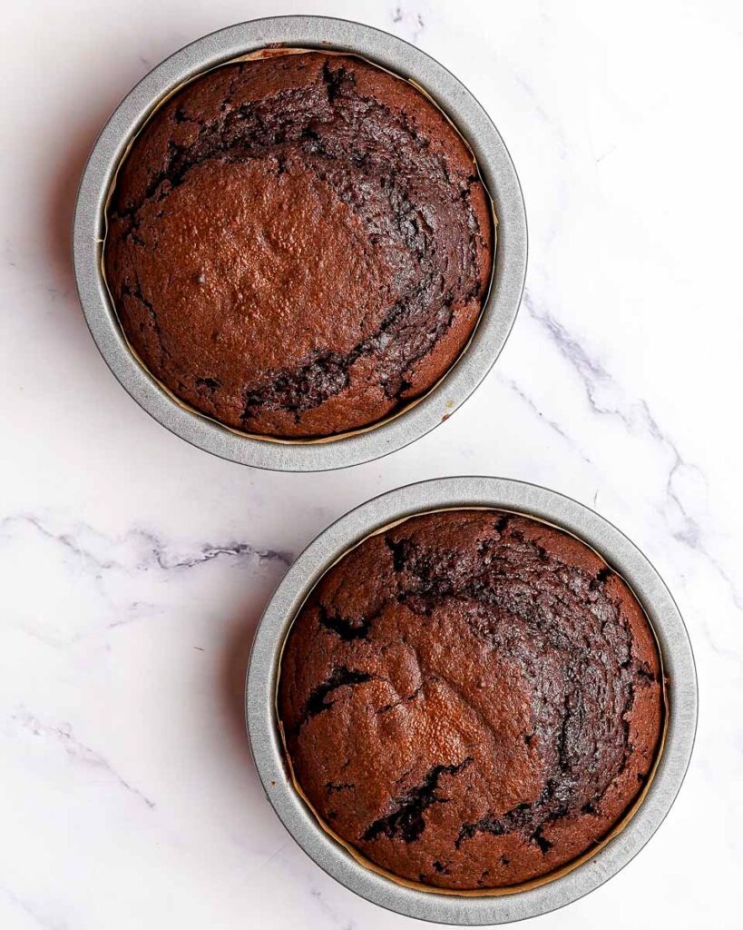 Two cakes after being baked before being removed from their cake tins.