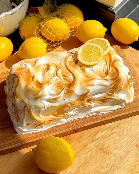 Lemon meringue upside down cheesecake covered in toasted meringue.