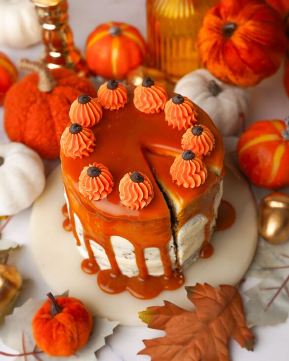 Mini sticky toffee pudding with a caramel drizzle and tiny buttercream pumpkins on top.