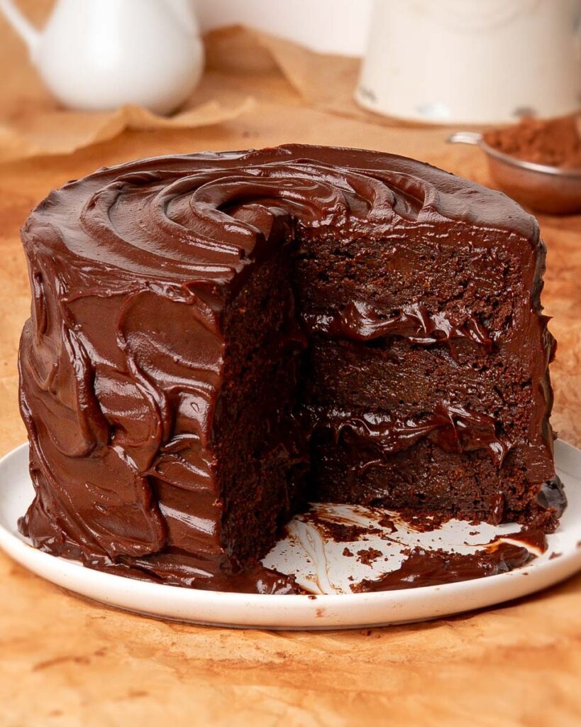 Six-ingredient-death-by-chocolate-cake.jpg - Ems Foodie Fix Six ingredient death by chocolate cake with a slice missing showing the inside.