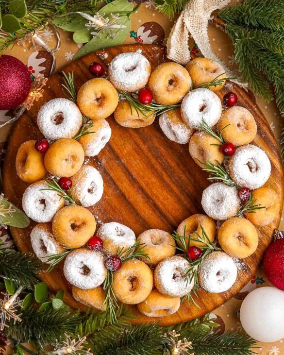 Easy Christmas Doughnut Wreath made with 3 Ingredients, mini doughnuts, cranberries and rosemary.