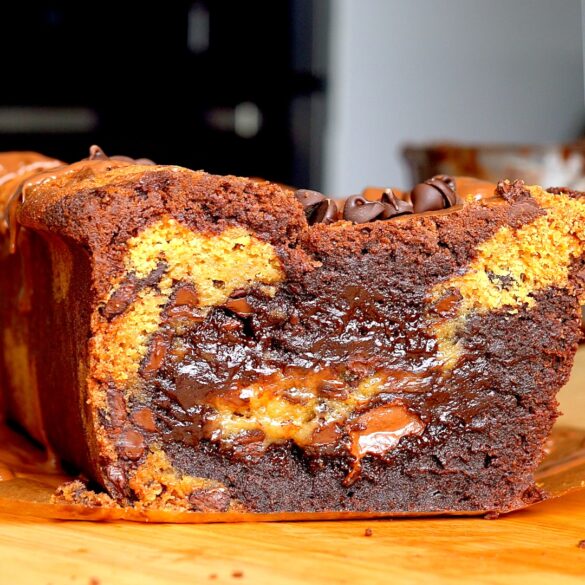 Brookie Loaf Cake showing the fudgy inside with swirls of brownie and cookie.