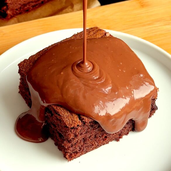 School Chocolate Sponge with Chocolate Custard being poured on top.