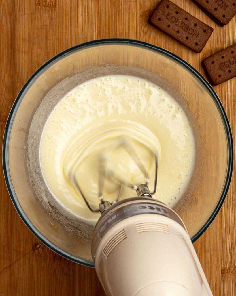 Eggs and sugar whisked together for Bourbon biscuit brownies,