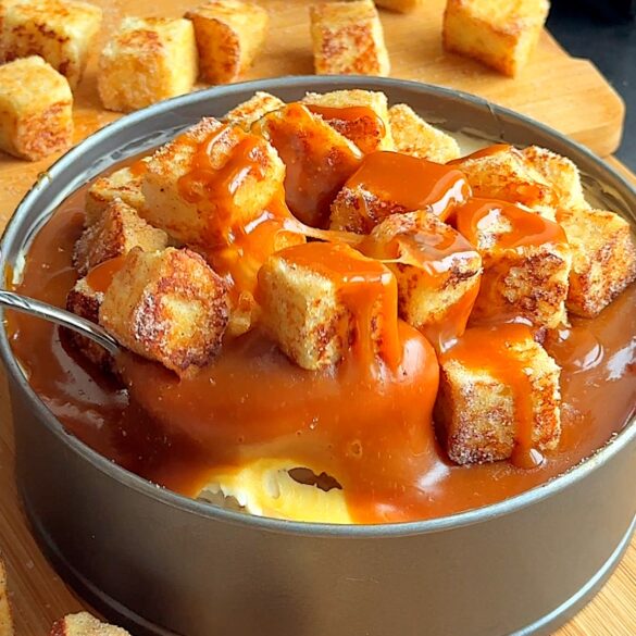 French-toast-caramel-cheesecake.jpg French toast caramel cheesecake with a spoon scooping a portion.