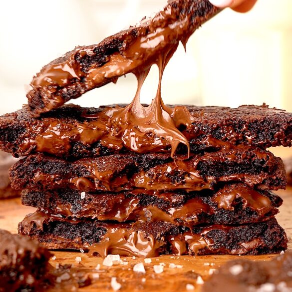 Triple Chocolate & Sea Salt Cookies stacked on top of each other.