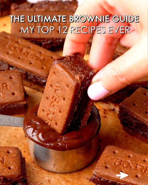 Bourbon brownies being dipped in a chocolate sauce pot.